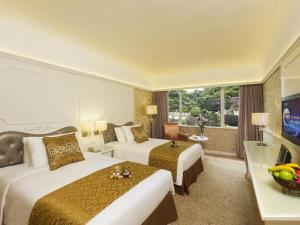 Televiisor ja/või meelelahutuskeskus majutusasutuses Hotel Riviera Macau