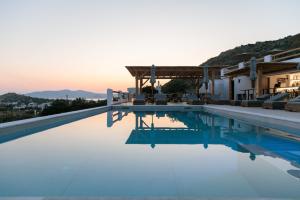 a view of a swimming pool at a villa at Naxos Earth Suites in Mikri Vigla
