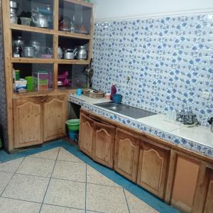 a kitchen with a sink and a counter top at Dar Brahim tizgui nbarda in Ouarzazate