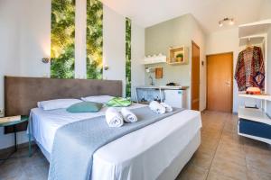 Postel nebo postele na pokoji v ubytování Hotel Discovery Thassos