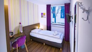 Postel nebo postele na pokoji v ubytování Hirsch Hotel Hanau