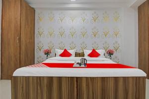 Кровать или кровати в номере Flagship Dwarka 23 Inn