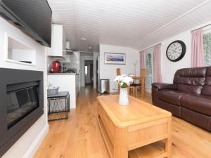 a living room with a couch and a table at 1 bed in Langbank 73845 in Langbank