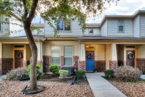 a house with a blue door and a tree at Inspiration - A Birdy Vacation Rental in San Antonio