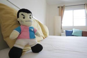 Postel nebo postele na pokoji v ubytování Lotus Suite Hua Hin