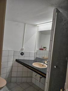 a bathroom with a sink and a mirror at Princess marfil in Biel