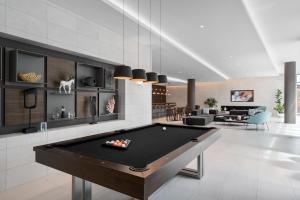 a living room with a pool table in it at 3900-504MQ DESIGN DISTRICT, CONDO 1 BEDROOM & 1 BATHROOM in Miami