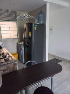Kuchyň nebo kuchyňský kout v ubytování Apartamento en Ricaurte, Arrayanes de Peñaliza