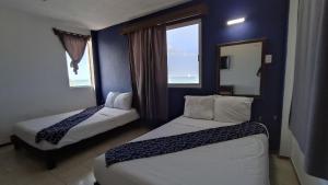 Postel nebo postele na pokoji v ubytování Hotel Tropical + 37 fotografií