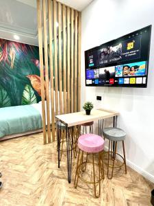 Televiisor ja/või meelelahutuskeskus majutusasutuses Loft in Borgo