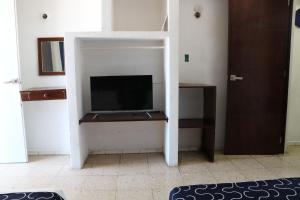Hotel Tropical TV 또는 엔터테인먼트 센터