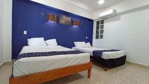 Hotel Tropical 객실 침대