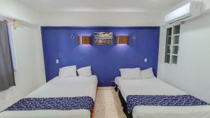 Hotel Tropical 객실 침대