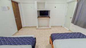 Hotel Tropical TV 또는 엔터테인먼트 센터