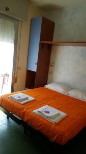 Postel nebo postele na pokoji v ubytování Hotel Majestic