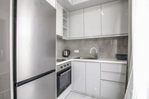 Η κουζίνα ή μικρή κουζίνα στο G Quattro Luxury Apartments