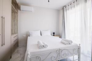 Ένα ή περισσότερα κρεβάτια σε δωμάτιο στο G Quattro Luxury Apartments +61 φωτογραφίες