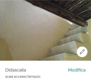 Una foto de una escalera con una pegatina. en Appartamentino San Gregorio Armeno & Rooms, en Nápoles
