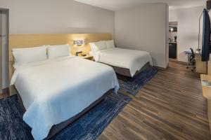 a hotel room with two beds and a television at Holiday Inn Express & Suites - Atlanta Downtown by IHG in Atlanta +94 photos