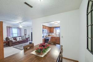 a kitchen and living room with a dining room table at Welcoming Condo in Davenport Central Location! in Davenport