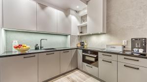 Kuchnia lub aneks kuchenny w obiekcie Rezydencja Niechorze 224 - 5D Apartamenty