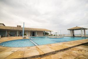 a large swimming pool with a gazebo at Bellevie Experience in Cascavel