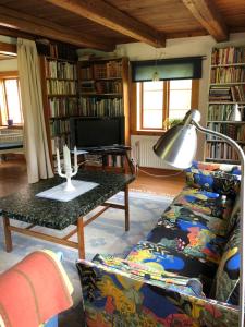 a living room with a couch and a table at Övra Berg in Ullared