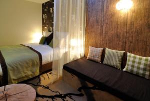 Postel nebo postele na pokoji v ubytování Hotel Cascade Resort & Spa