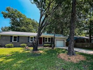 a house with two trees in the yard at Escape Pine Forest- Getaway Experience in Summerville