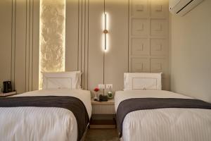 Letto o letti in una camera di Pyramids Charm Hotel