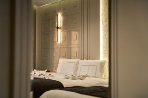 Letto o letti in una camera di Pyramids Charm Hotel