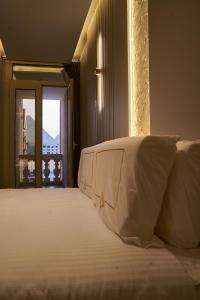 Letto o letti in una camera di Pyramids Charm Hotel