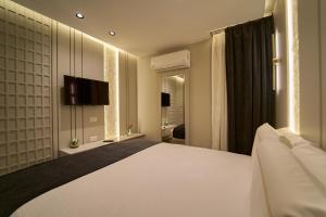 Letto o letti in una camera di Pyramids Charm Hotel