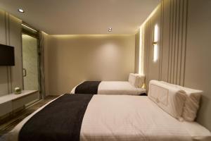 Letto o letti in una camera di Pyramids Charm Hotel