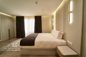 Letto o letti in una camera di Pyramids Charm Hotel