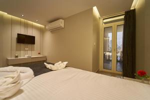 Letto o letti in una camera di Pyramids Charm Hotel