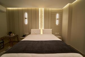 Letto o letti in una camera di Pyramids Charm Hotel