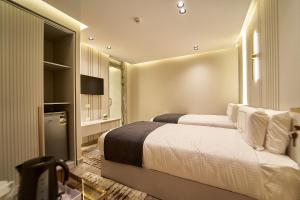 Letto o letti in una camera di Pyramids Charm Hotel