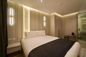 Letto o letti in una camera di Pyramids Charm Hotel