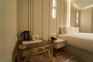 Letto o letti in una camera di Pyramids Charm Hotel