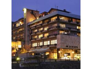 a large building with many windows at night at Toi Fujiya Hotel - Vacation STAY 27089v in Izu