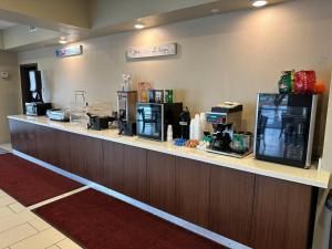 a counter in a hotel room with a coffee shop at Expo Inn and Suites Belton Temple South I-35 in Belton