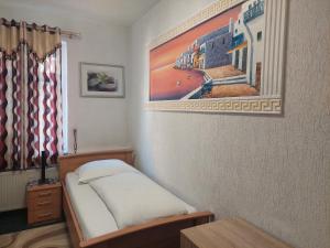 Säng eller sängar i ett rum på Hotel Restaurant Rhodos