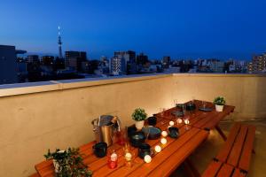 a table on a rooftop with a view of a city at Kiyosumi SOHO4B, 5th floor, 6th floor - Vacation STAY 20622v in Tokyo
