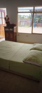 A bed or beds in a room at Tu Hogar en la Tierra del Cacao