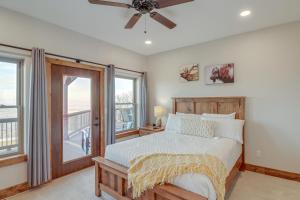 a bedroom with a bed and a window at Spacious Harrison Vacation Rental with Deck and Views! in Harrison
