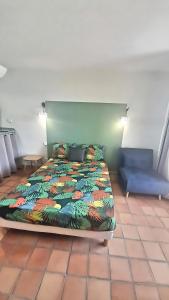 Ліжко або ліжка в номері Suite du Moqueur Gorge Blanche