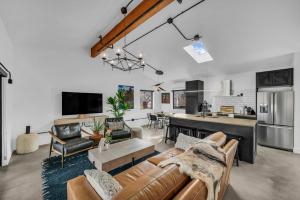 a living room with a couch and a kitchen at Canyon Casitas at Zion in Springdale
