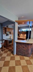 a living room with a kitchen with a counter top at Kasia house in Warsaw +15 photos