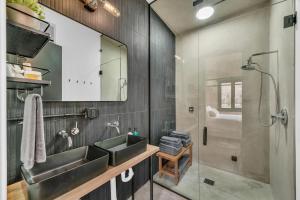a bathroom with two sinks and a shower at Canyon Casitas at Zion in Springdale +71 photos
